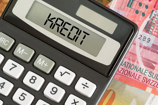 Banknotes Swiss francs, credit and calculator
