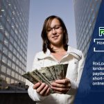 A woman holding a stack of secure payday loans money in her hands