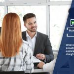 A woman shaking hands with a man in an office explaining how to pick a payday loan provider