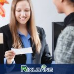 A woman holding a piece of Indiana payday loans agreement paper in her hand