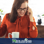 A women smiling and talking on a phone about personal loans online no credit check for bad credit
