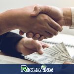 Two people shaking hands over a pile of money obtained from a payday loan in California