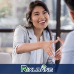 A woman talking to a man in front of a window about the best option for her credit score between payday loans and credit cards