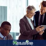 A man and a woman looking at a tablet reading about installment loans Montana