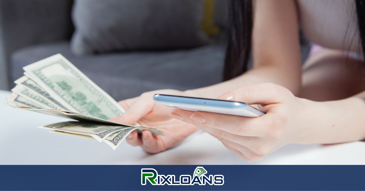 A woman holding a smart phone and a stack of money from installment loans Virginia