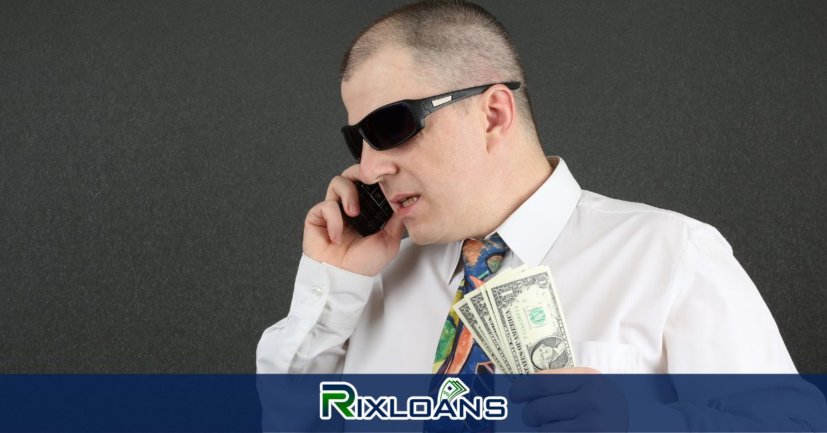 A man talking on a cell phone while holding money from installment loans Wisconsin