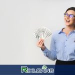 A woman holding a cell phone and a fan of money from installment loans Wyoming