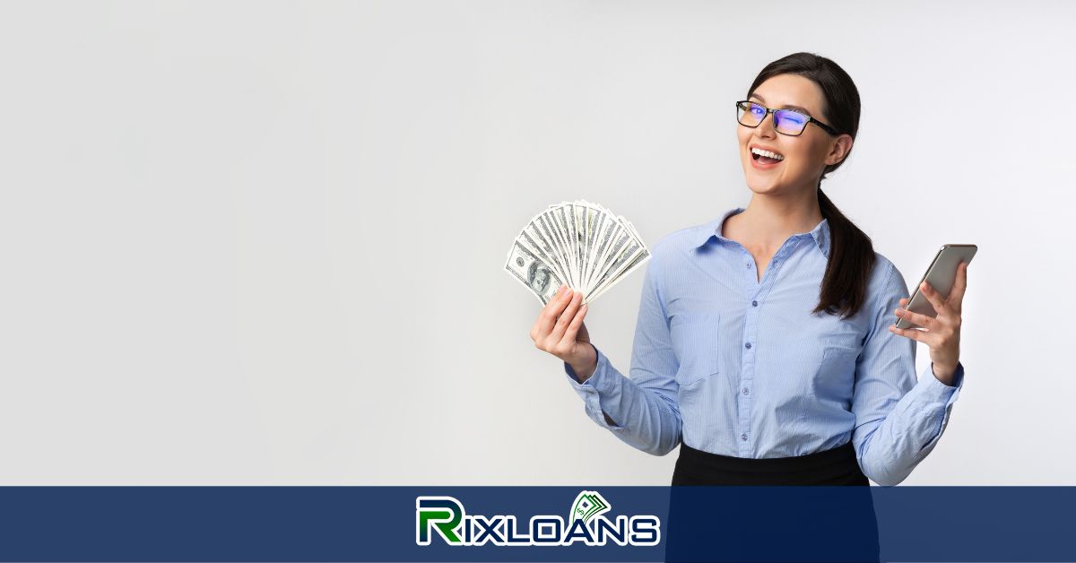 A woman holding a cell phone and a fan of money from installment loans Wyoming